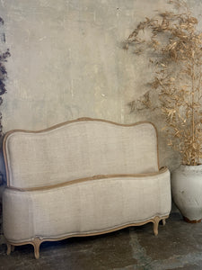 French linen covered king size bed