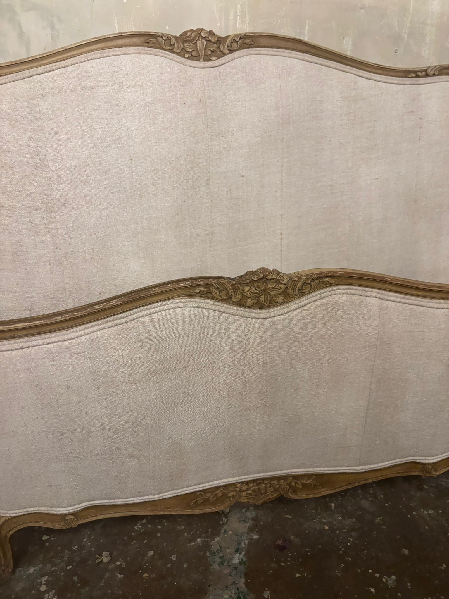 French linen covered king size bed