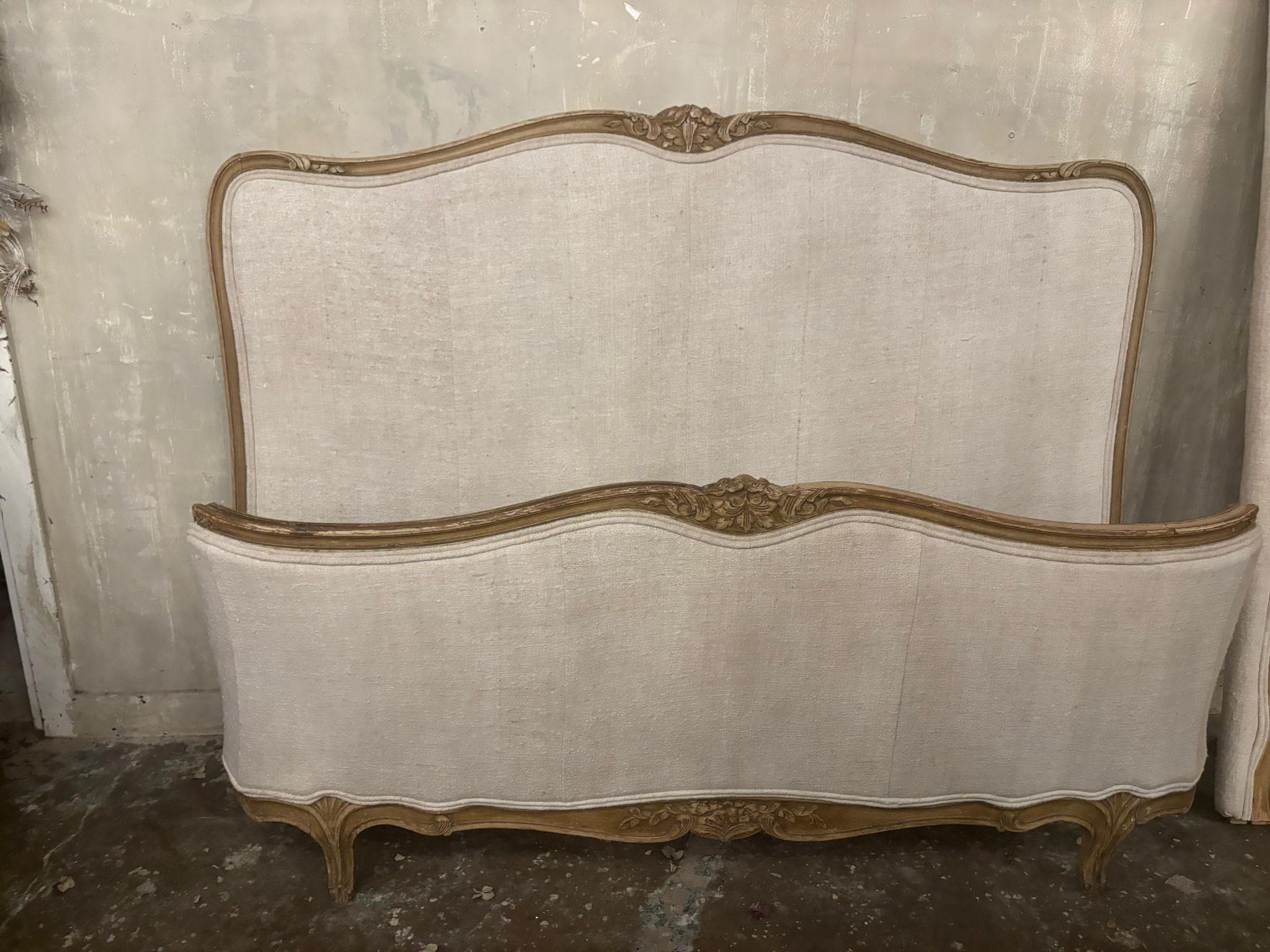 French linen covered king size bed