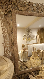 Intricate carved mirror