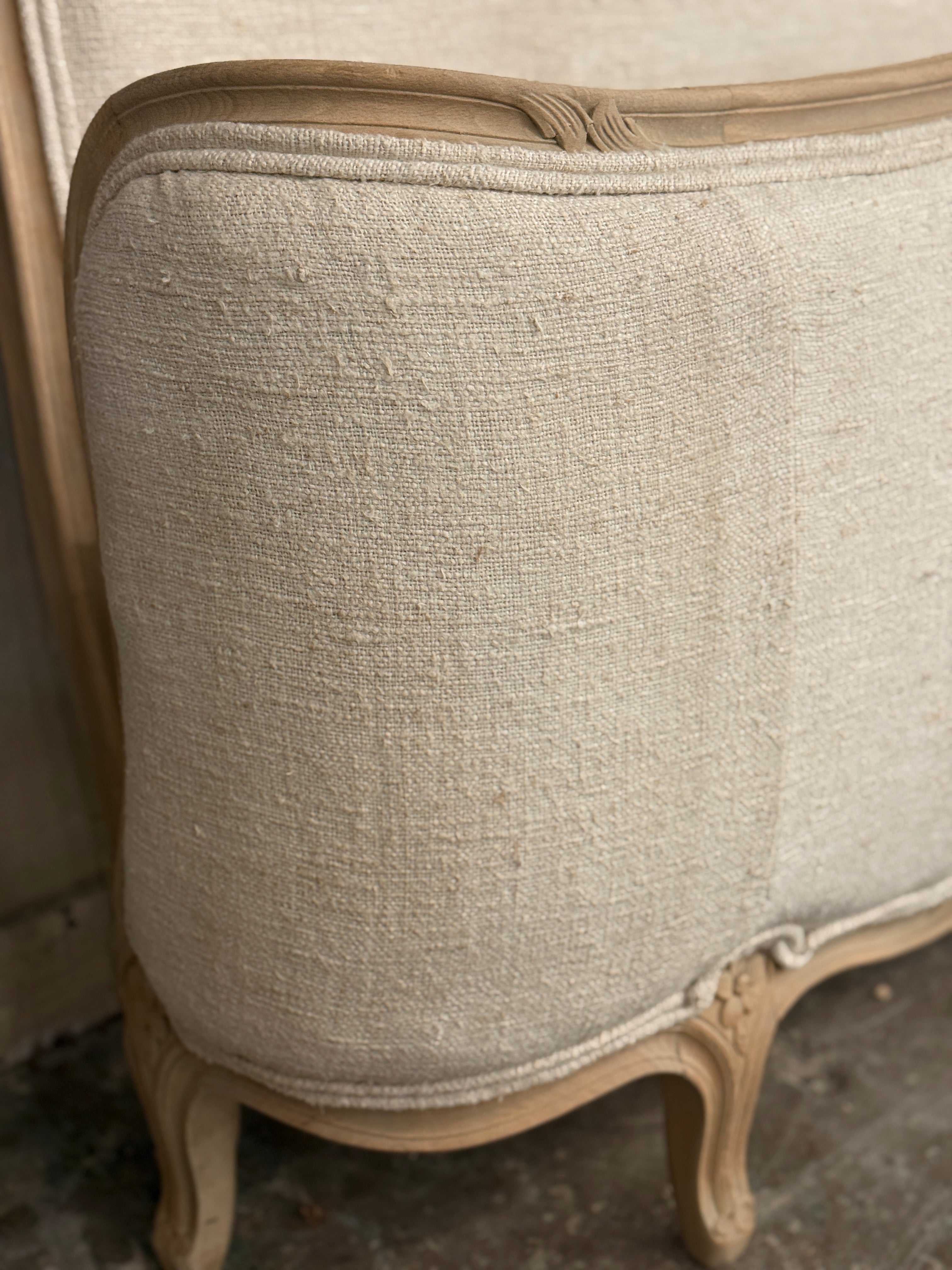 French linen covered king size bed