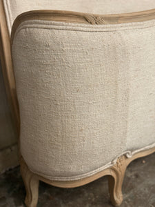 French linen covered king size bed