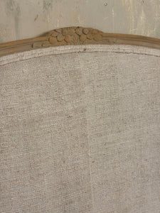 French linen covered king size bed