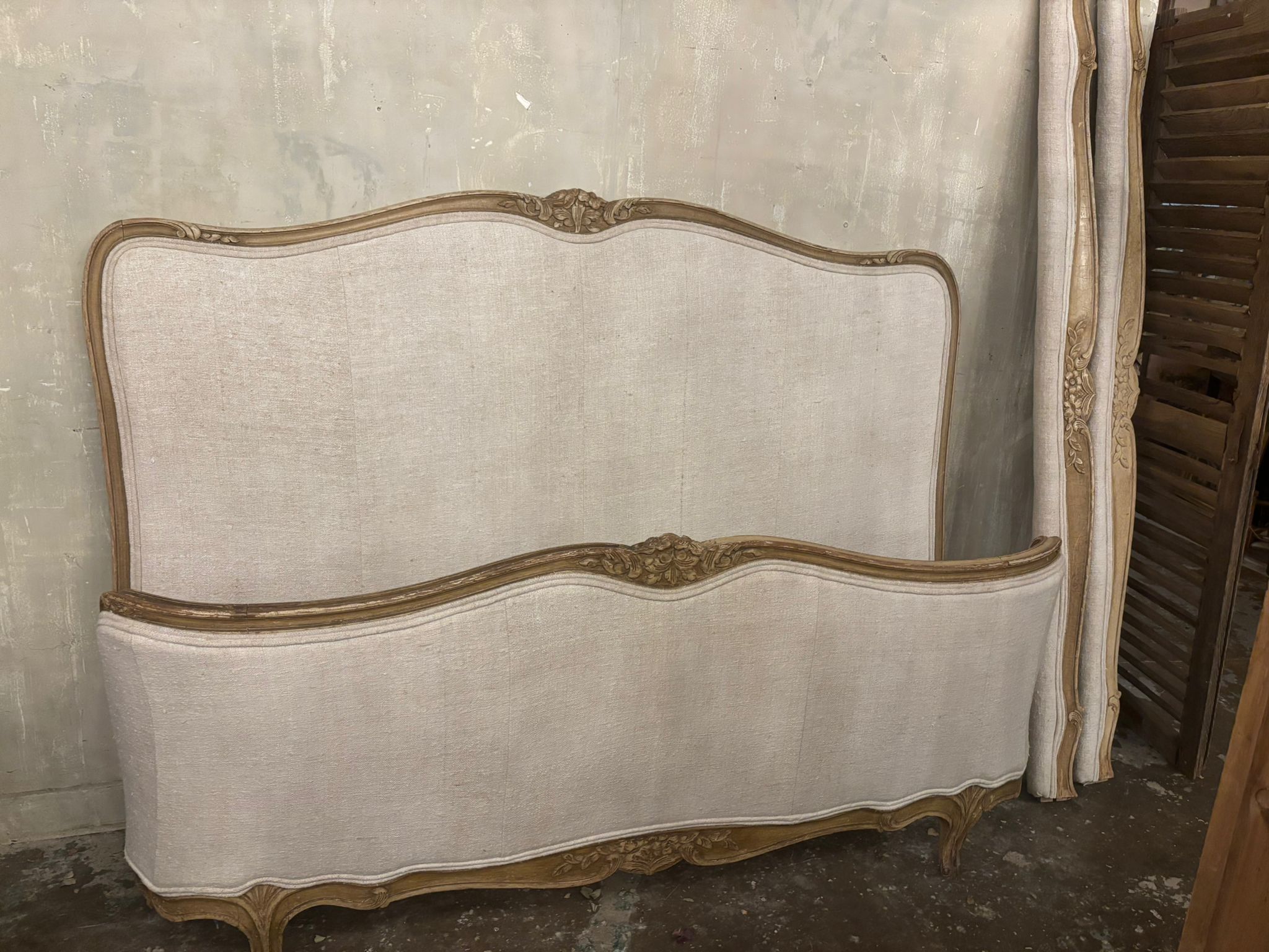 French linen covered king size bed